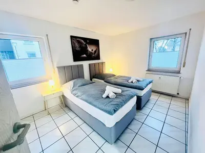 Ein Bett oder Betten in einem Zimmer der Unterkunft Homely - modern - für 4 - Boxspringbetten - Internet
