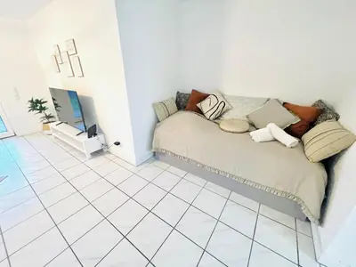 Ein Bett oder Betten in einem Zimmer der Unterkunft Homely - modern - für 4 - Boxspringbetten - Internet