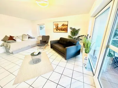 Ein Sitzbereich in der Unterkunft Homely - modern - für 4 - Boxspringbetten - Internet