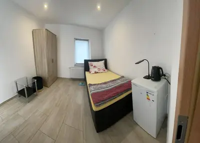 Ein Bett oder Betten in einem Zimmer der Unterkunft Schönes gemütlicher Zimmer In Zentrum Rüsselsheim