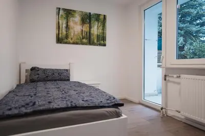Ein Bett oder Betten in einem Zimmer der Unterkunft Monteurswohnungen in den Breitwiesen