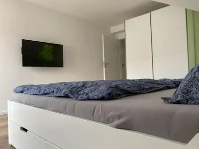 Ein Bett oder Betten in einem Zimmer der Unterkunft Monteurswohnungen in den Breitwiesen