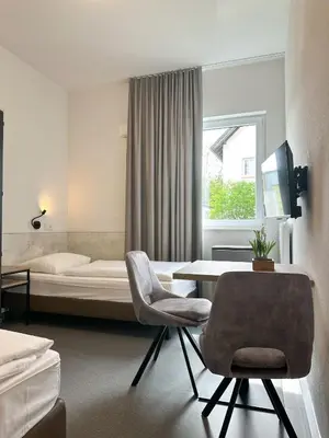 Ein Bett oder Betten in einem Zimmer der Unterkunft Longhouse Aparthotel