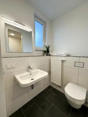 Ein Badezimmer in der Unterkunft Longhouse Aparthotel