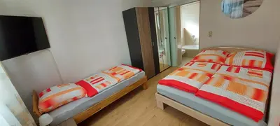 Ein Bett oder Betten in einem Zimmer der Unterkunft Apartment Popp Heilbronn