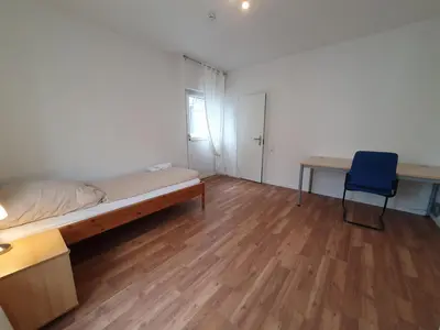 Ein Bett oder Betten in einem Zimmer der Unterkunft Privatzimmer an der Universitätsklinik Mainz-sehr zentral