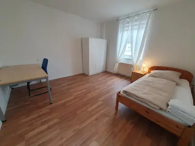 Ein Bett oder Betten in einem Zimmer der Unterkunft Privatzimmer an der Universitätsklinik Mainz-sehr zentral