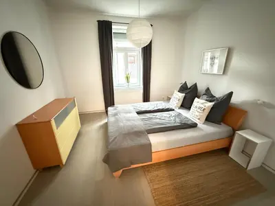 Ein Bett oder Betten in einem Zimmer der Unterkunft Schmuckstück an der Wormser Stadtmauer