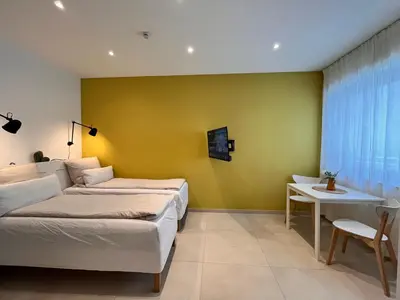 Ein Bett oder Betten in einem Zimmer der Unterkunft Goldstadt Apartments Pforzheim