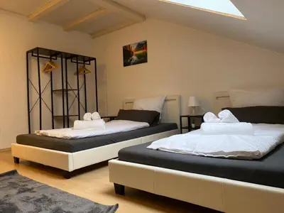 Ein Bett oder Betten in einem Zimmer der Unterkunft STN Deluxe Suite - Ferienwohnung mit 2 Schlafzimmer & Parkplatz, Highspeed WLAN, Netflix Premium, Zentral zu Audi & Schwarz Gruppe