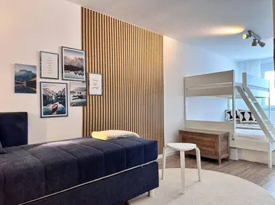 Ein Bett oder Betten in einem Zimmer der Unterkunft Appartio: Geräumige, moderne Ferienwohnung für Gruppen/Familien