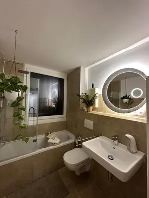 Ein Badezimmer in der Unterkunft Hellenbrand: Stilvolles Apartment über den Dächern