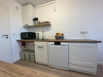 Küche/Küchenzeile in der Unterkunft Hellenbrand: Stilvolles Apartment über den Dächern
