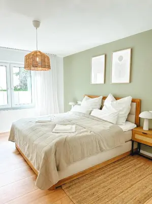 Ein Bett oder Betten in einem Zimmer der Unterkunft Modernes Apartment 5 Min zur Messe Parkplatz