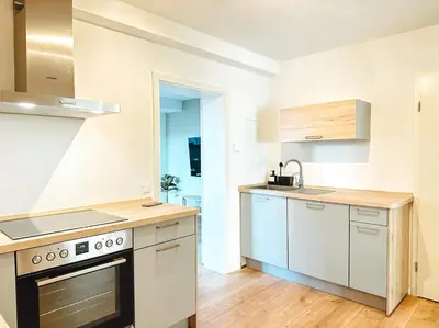 Küche/Küchenzeile in der Unterkunft Modernes Apartment 5 Min zur Messe Parkplatz