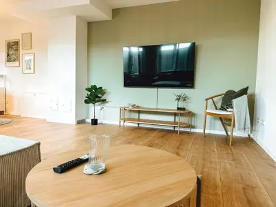 TV/Unterhaltungsangebot in der Unterkunft Modernes Apartment 5 Min zur Messe Parkplatz