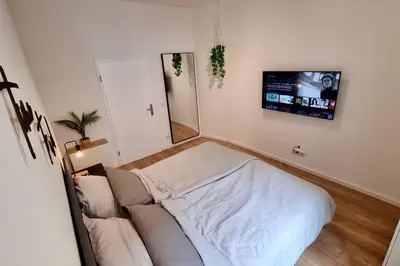 Ein Bett oder Betten in einem Zimmer der Unterkunft Stylisches Apartment in zentraler Lage mit Balkon