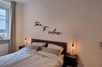 Ein Bett oder Betten in einem Zimmer der Unterkunft Stylisches Apartment in zentraler Lage mit Balkon