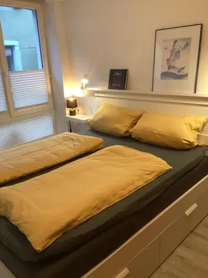 Ein Bett oder Betten in einem Zimmer der Unterkunft Ferienhäuschen am Heumarkt