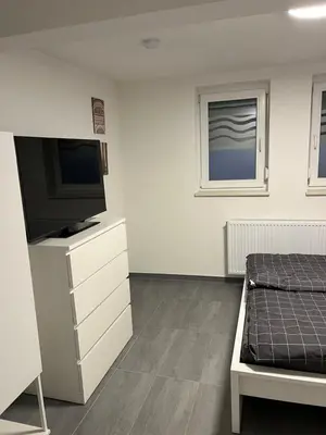 Ein Bett oder Betten in einem Zimmer der Unterkunft Home-for-you-Ferienwohnung Monteurwohnung