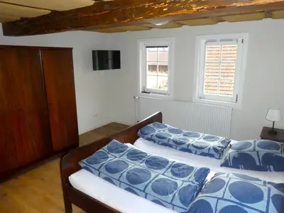 Ein Bett oder Betten in einem Zimmer der Unterkunft Alte Schreinerei