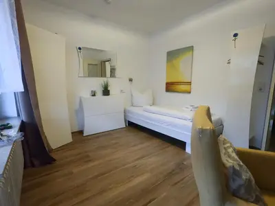Ein Bett oder Betten in einem Zimmer der Unterkunft Hotel Sonnenhof Garni