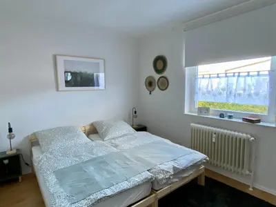 Ein Bett oder Betten in einem Zimmer der Unterkunft Die 2eitwohnung