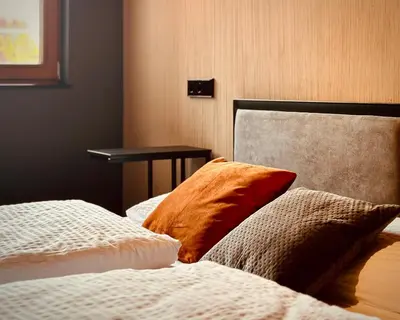 Ein Bett oder Betten in einem Zimmer der Unterkunft Stadthaus Neckarsulm serviced apartments – Stadthaus Heiner