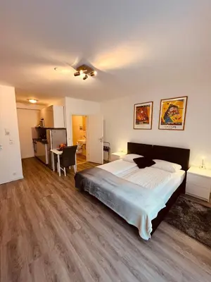 Ein Bett oder Betten in einem Zimmer der Unterkunft Schubart Apartments