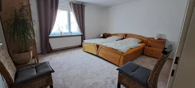 Ein Bett oder Betten in einem Zimmer der Unterkunft Ferienwohnung Ilona