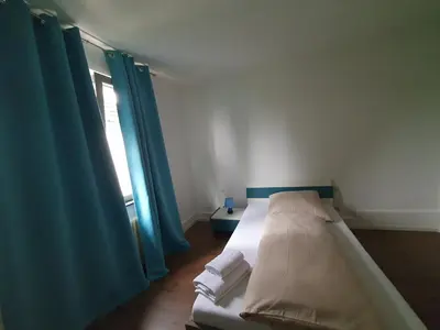 Ein Bett oder Betten in einem Zimmer der Unterkunft Privatzimmer an der Uniklinik Mainz, sehr zentral