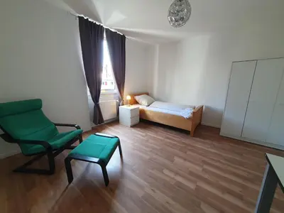 Ein Bett oder Betten in einem Zimmer der Unterkunft Privatzimmer an der Uniklinik Mainz, sehr zentral