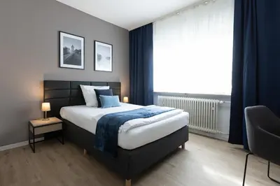 Ein Bett oder Betten in einem Zimmer der Unterkunft Hotel Wegener