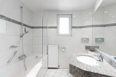 Ein Badezimmer in der Unterkunft Hotel Wegener