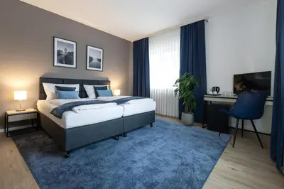 Ein Bett oder Betten in einem Zimmer der Unterkunft Hotel Wegener
