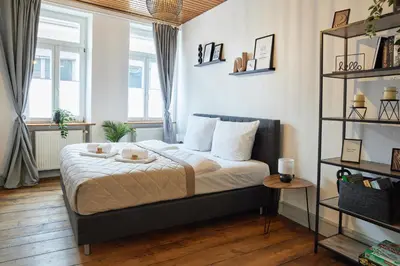 Ein Bett oder Betten in einem Zimmer der Unterkunft UPPER ROOM Altstadt-Apartment im Herzen der Pfalz