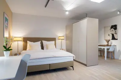 Ein Bett oder Betten in einem Zimmer der Unterkunft Livingroom Mathildenhöhe
