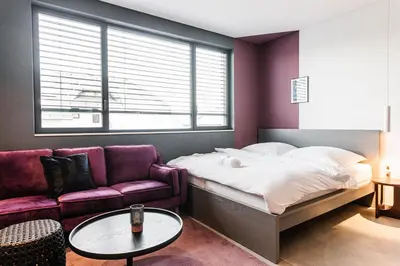 Ein Bett oder Betten in einem Zimmer der Unterkunft Exklusive Design Appartement BlackBerry Neubau