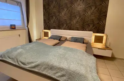 Ein Bett oder Betten in einem Zimmer der Unterkunft Ferienwohnung zwischen Wald und Reben