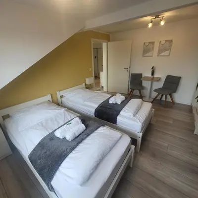 Ein Bett oder Betten in einem Zimmer der Unterkunft Schöne FeWo nähe Schwetzingen-Hockenheim
