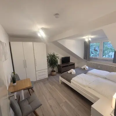 Ein Bett oder Betten in einem Zimmer der Unterkunft Schöne FeWo nähe Schwetzingen-Hockenheim