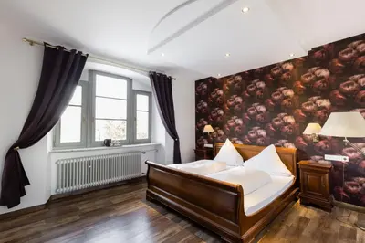 Ein Bett oder Betten in einem Zimmer der Unterkunft Eventlocation & Hotel Schloss Neuburg