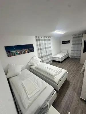 Ein Bett oder Betten in einem Zimmer der Unterkunft Tolle FeWo direkt am Campus 24-7 Checkin