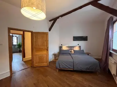 Ein Bett oder Betten in einem Zimmer der Unterkunft Ferienwohnung Unterm Schloß