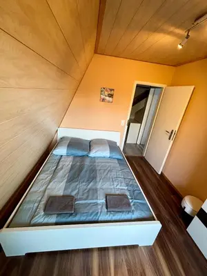 Ein Bett oder Betten in einem Zimmer der Unterkunft Ferienhaus Veronika Odenwald