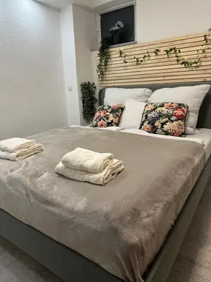 Ein Bett oder Betten in einem Zimmer der Unterkunft Moderne ruhige Ferienwohnung