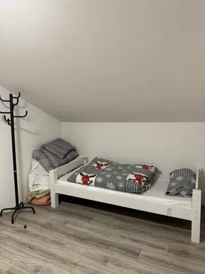 Ein Bett oder Betten in einem Zimmer der Unterkunft Kuscheliges Einfamilienhaus
