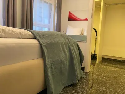 Ein Bett oder Betten in einem Zimmer der Unterkunft Wohnung mit Dachterrasse
