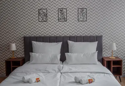 Ein Bett oder Betten in einem Zimmer der Unterkunft Penthouse-Maisonette - City Center, Highspeed Internet, Garage