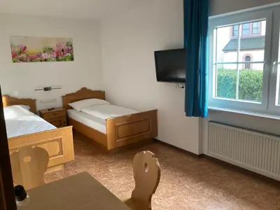 Ein Bett oder Betten in einem Zimmer der Unterkunft Pension Dorfengel